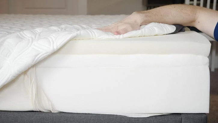 A mattress is opened to show its design. The Cocoon Chill mattress is opened to show its design