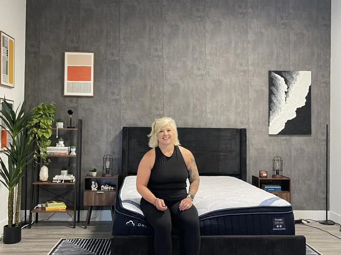 Sosha poses with the DreamCloud Premier Memory Foam Mattress