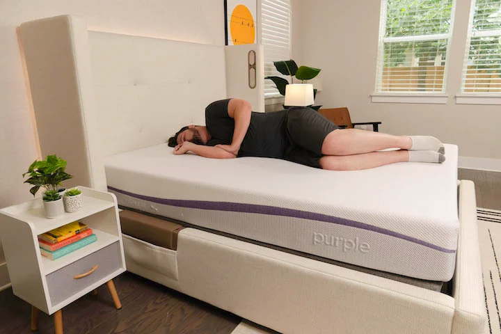 a man sleeps on his side on the Purple Original mattress