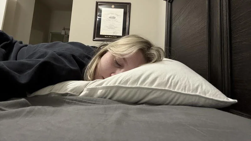 Our tester side sleeping on the Helix Down Pillow