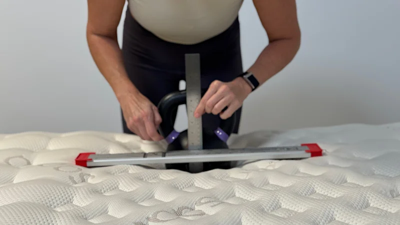 Kettlebell sinkage test on the Saatva Loom & Leaf Mattress