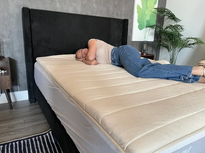 Our tester using a Birch Plush Organic Mattress Topper
