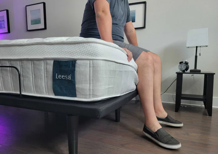 A man sits near the edge of the Leesa Sapira Chill Hybrid