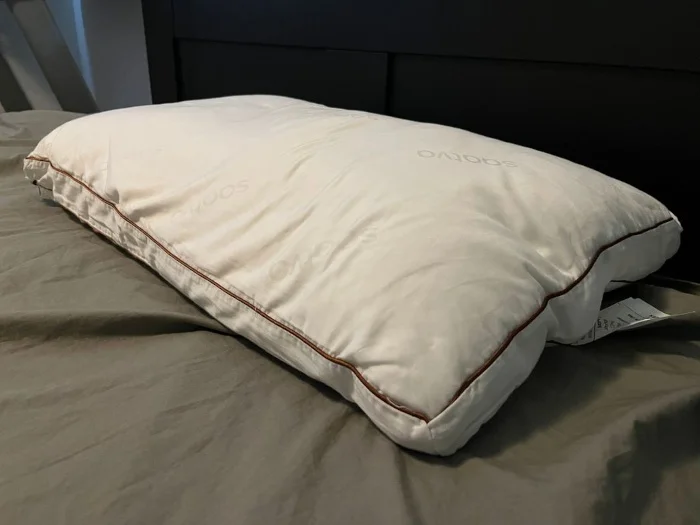 A Saatva Latex Pillow on a bed