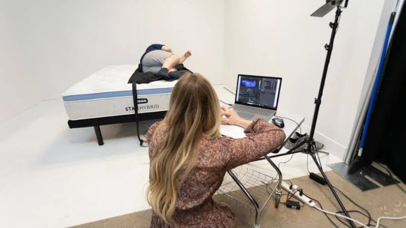 Our team of testers measuring pressure map results for the Bear Star Hybrid mattress
