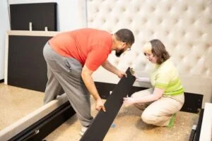 Our testers assembling the Saatva Amalfi Storage Bed Frame