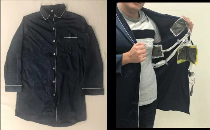 Researchers Unveil Smart Pajama Sleep Tracker A researcher shows the sensor patches in a pajama shirt.