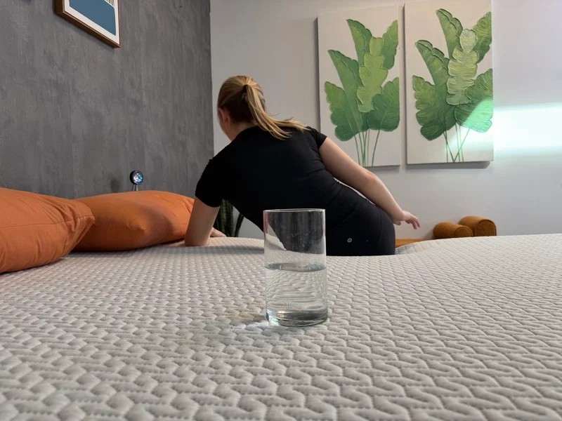 Motion isolation test with a water glass on the Tuft and Needle Original mattress