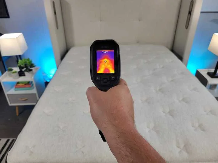 a man points a heat gun at the Helix Midnight Luxe