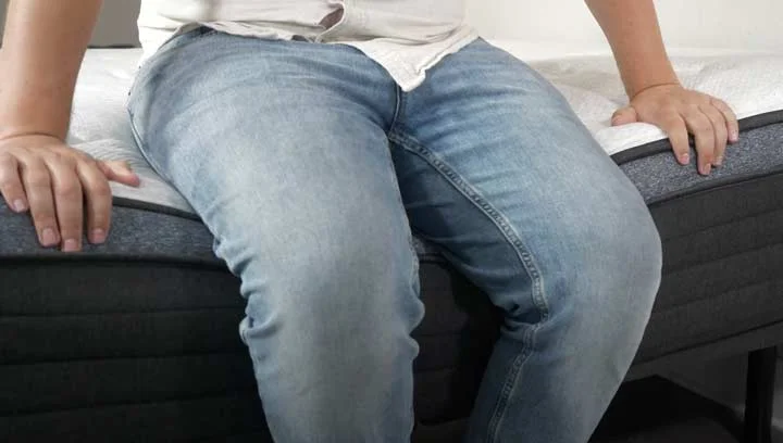 A man sits near the edge of the Helix Moonlight Luxe A man sits near the edge of the Helix Moonlight Luxe