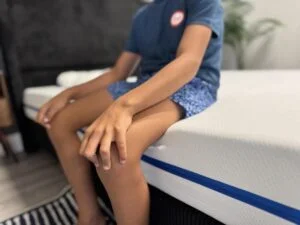 Seated edge support test on the Nectar Kids Mattress