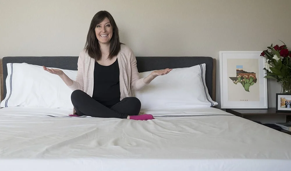 woman sitting on bed