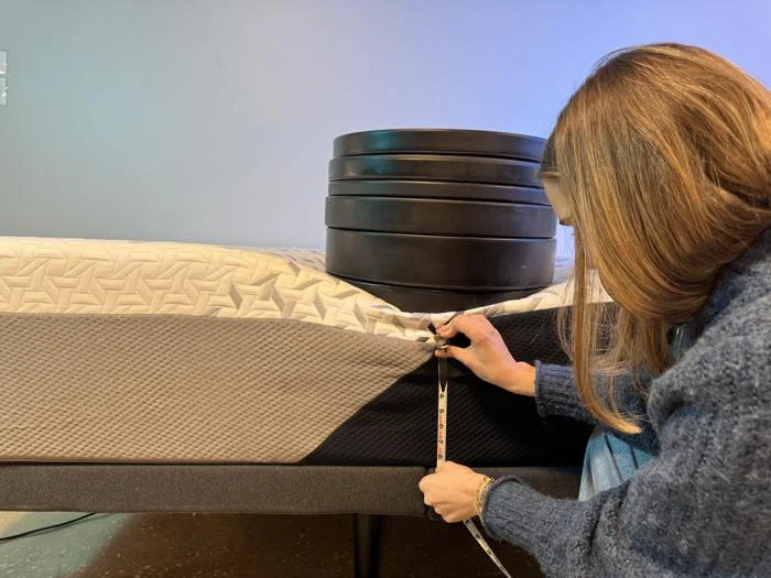 Measuring a lot of plates on the edge of a Nectar Luxe Memory Foam Mattress