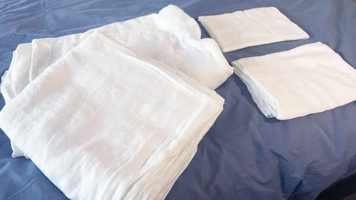 Saatva Linen Sheets Set An image of the four pieces that come in the Saatva Linen Sheet set.