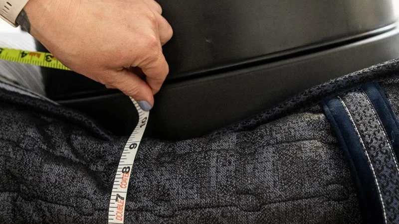 Our tester measures the sinkage from weight plates along the edge of the Serta Perfect Sleeper Kendall X Mattress