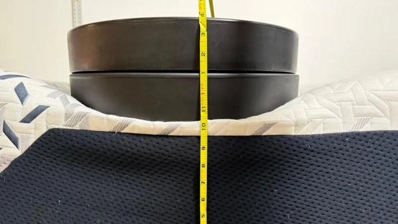 Measuring the deflection of weight plates along the edge of the Nectar Luxe Memory Foam Mattress