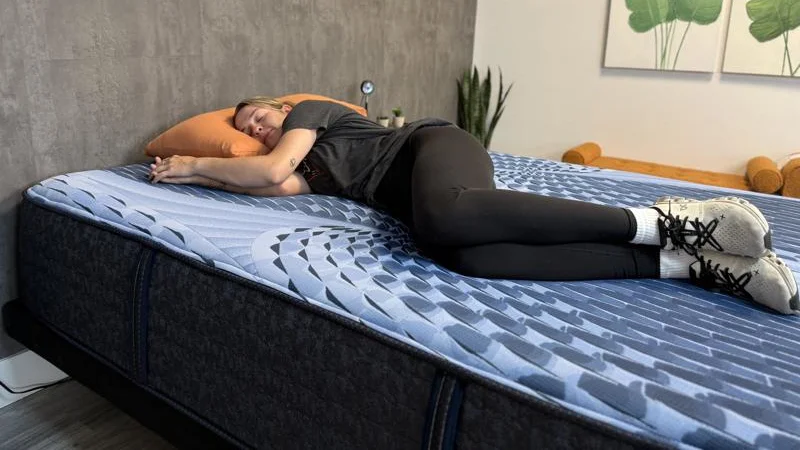 A person side sleeping on the Serta iComfort Aspire Mattress