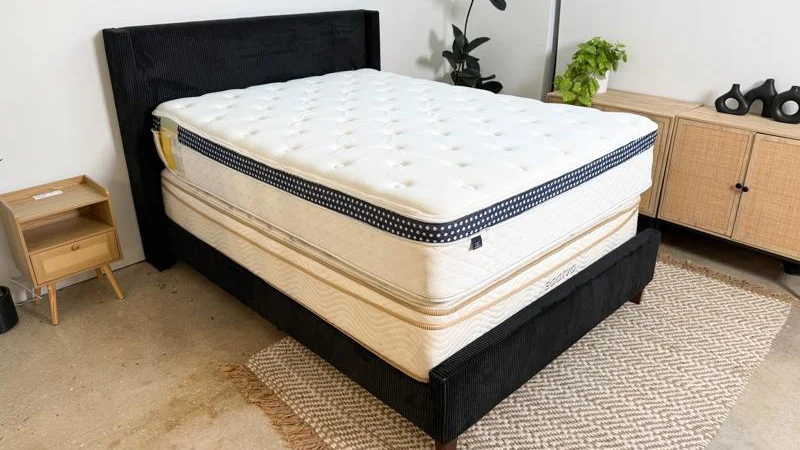 Angled view of a WinkBed mattress on top of a Saatva Classic mattress