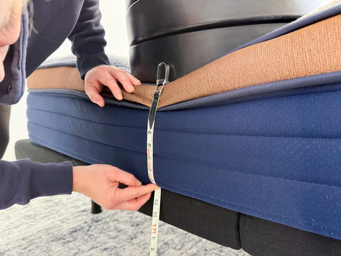 Measuring sinkage caused by weight plates on top of the Brooklyn Bedding CopperFlex mattress