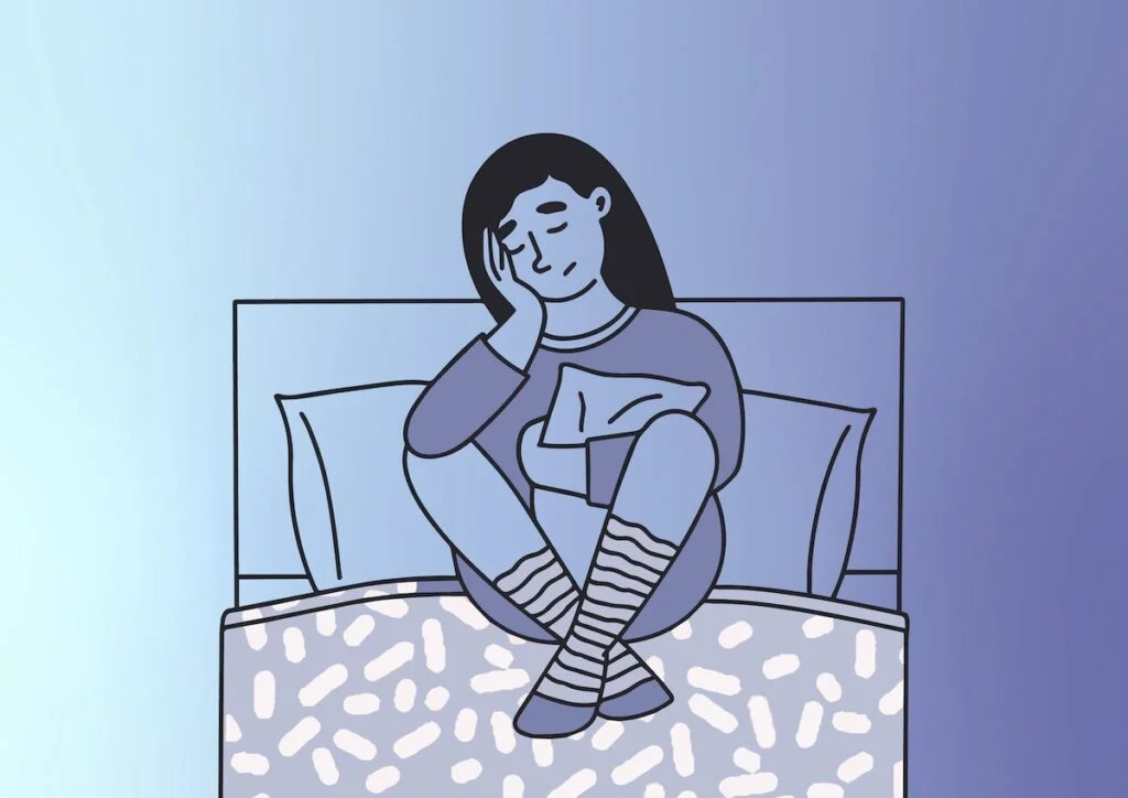 woman worrying in bed