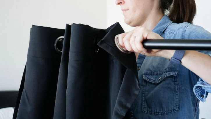 Add Curtain To Rod & Twist On Knobs how to hang blackout curtain step5 1