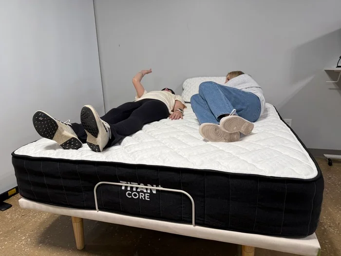 Testing motion isolation on the Titan Plus Core mattress by having two testers move around next to one another