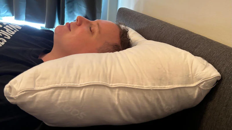 Our tester back sleeping on the Saatva Down Alternative Pillow