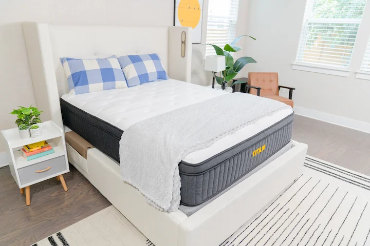 the Titan Plus mattress sits on a bed frame