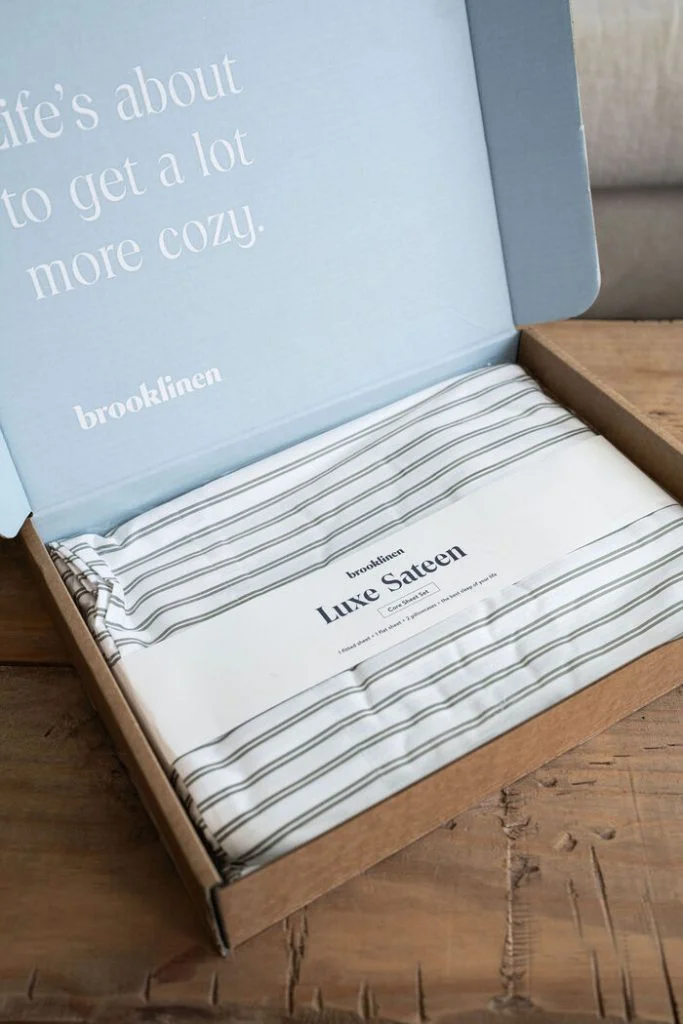 Brooklinen Luxe Sateen sheets folded in a box