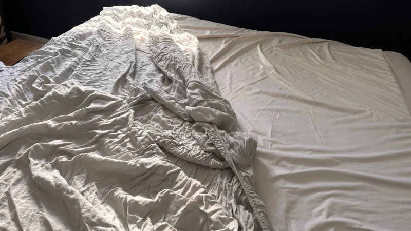 Making a bed with the Parachute Home Linen Sheet Set