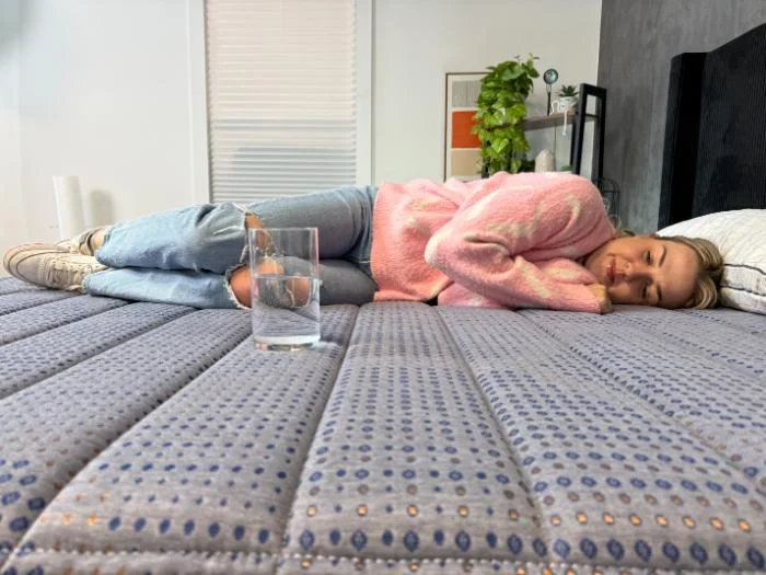 Our tester performing the ripple test on the Brooklyn Bedding CopperFlex