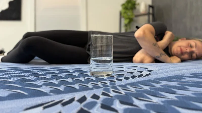 Our tester conducts a ripple test of motion isolation on the Serta iComfort Aspire Mattress