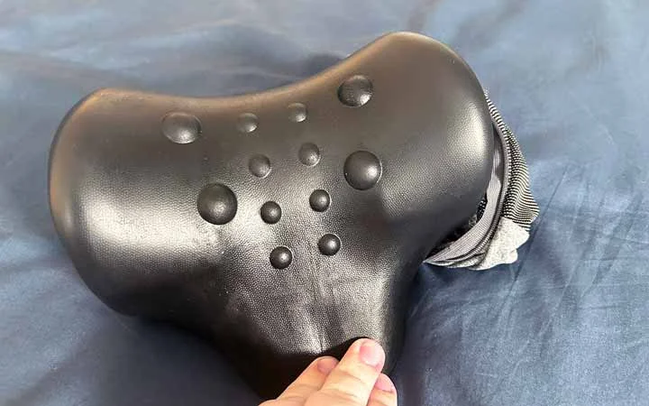 An image that shows off the raised massage points of the NekGenic Neck Pillow.
