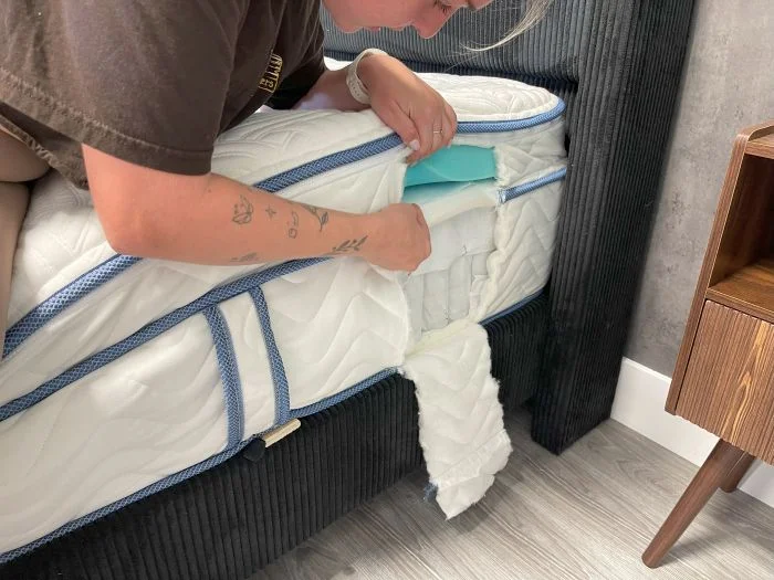 A person shows the layers of the DLX Premier Hybrid