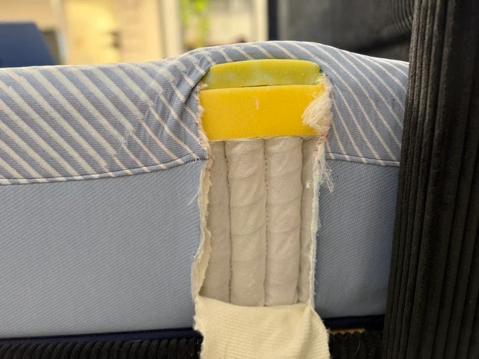 view of the springs and foam layers inside the sealy posturepedic hybrid mattress