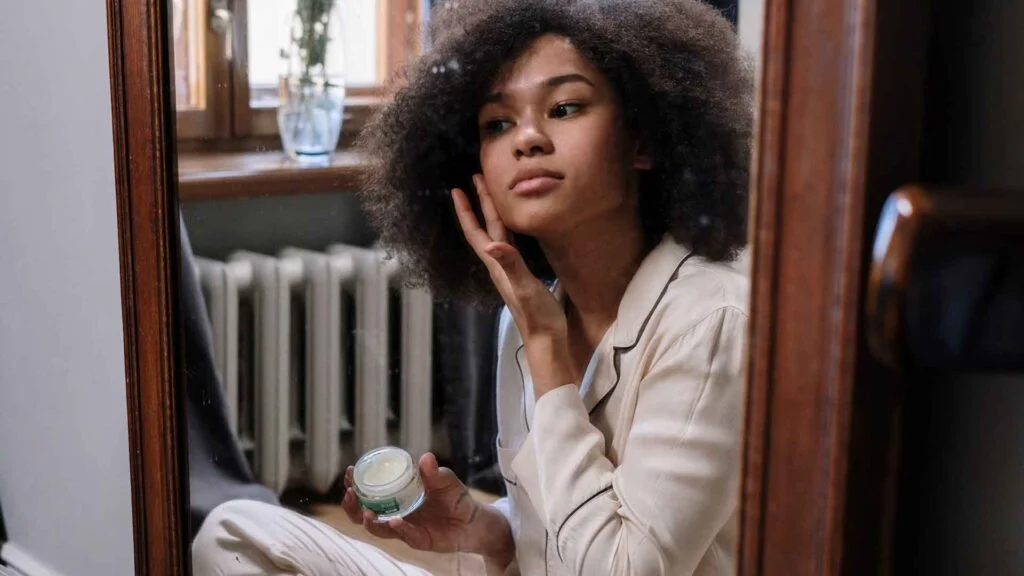 Woman looking at skin